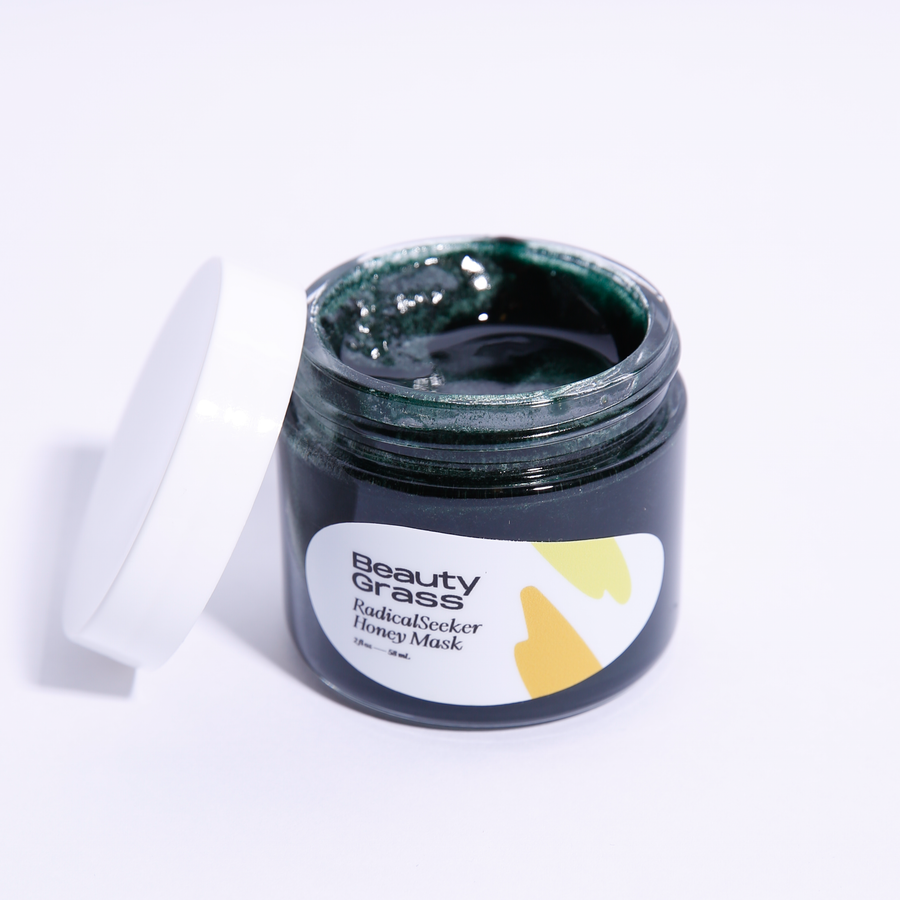 Natural Acne Face Mask, Radical Seeker. White background, lid open, green mask inside