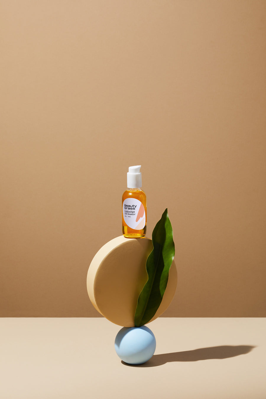 Balancing Oil Cleanser, GoldenHigh. Totem Stacked with leaf.